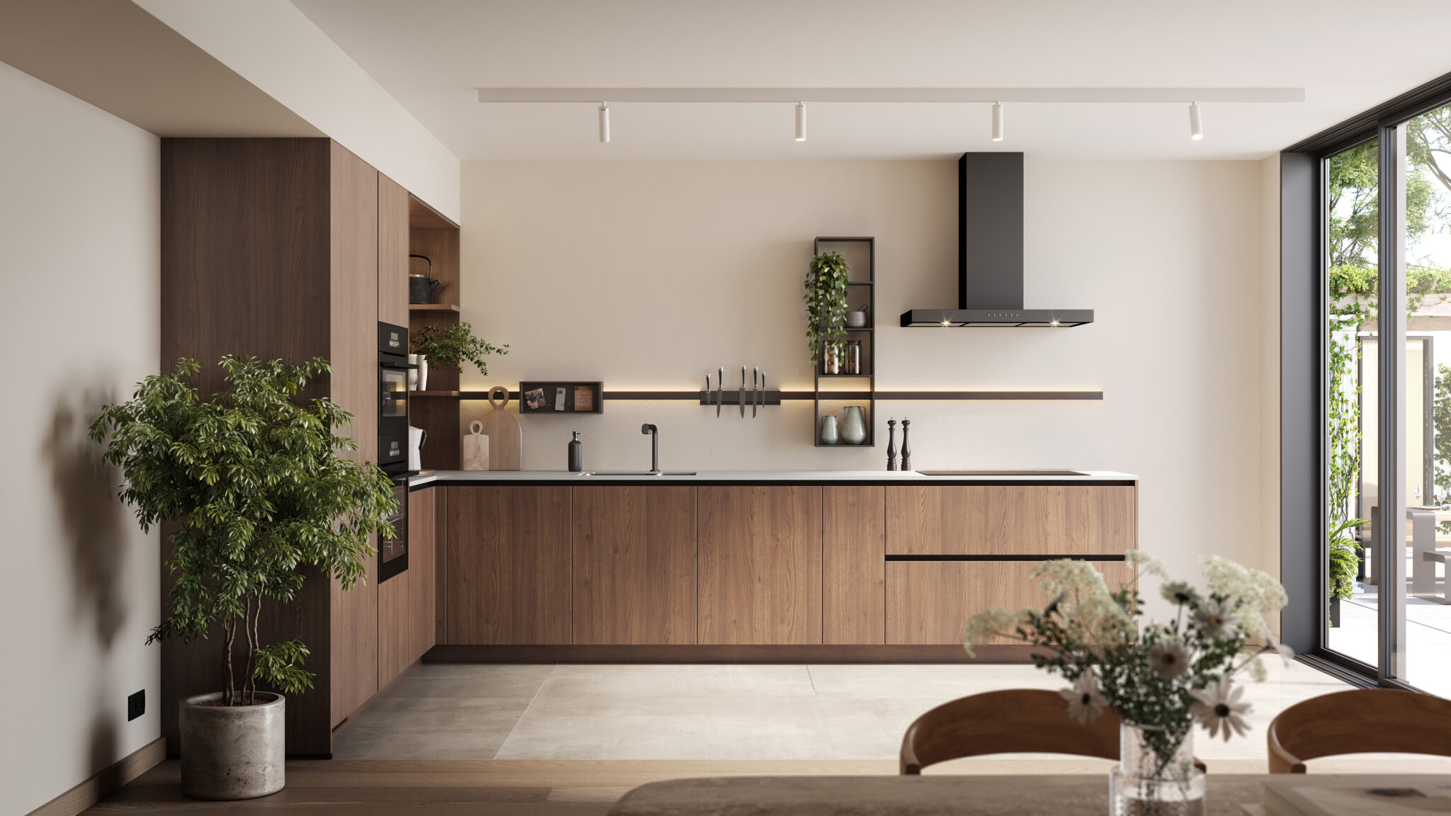 Cuisine moderne avec meubles en bois sombre, plan de travail noir, plantes décoratives, et grande baie vitrée laissant entrer la lumière naturelle.